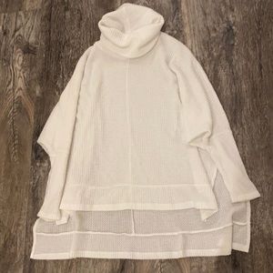 White high-low turtleneck sweater